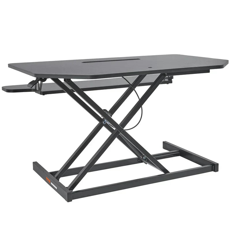 Adjustable standing desk converter riser designed for a sit stand home office setup.