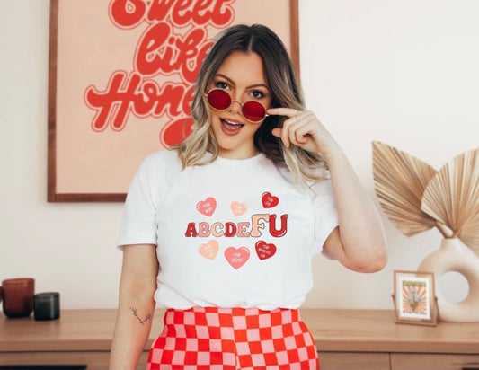 Trendy slogan graphic t-shirt with red and pink hearts print design