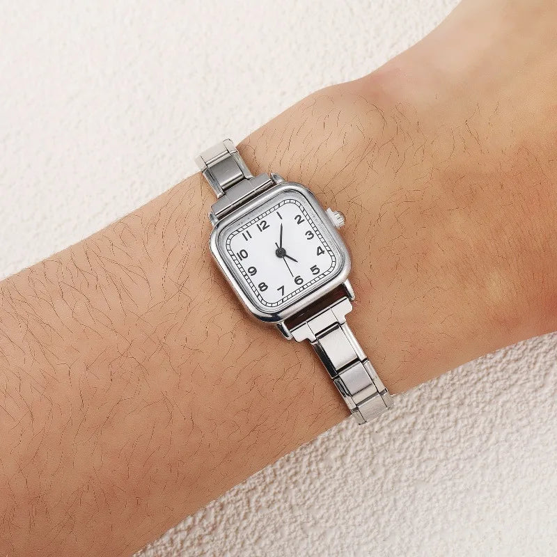 accurate quartz movement watch linker showing rear female track mounting locks