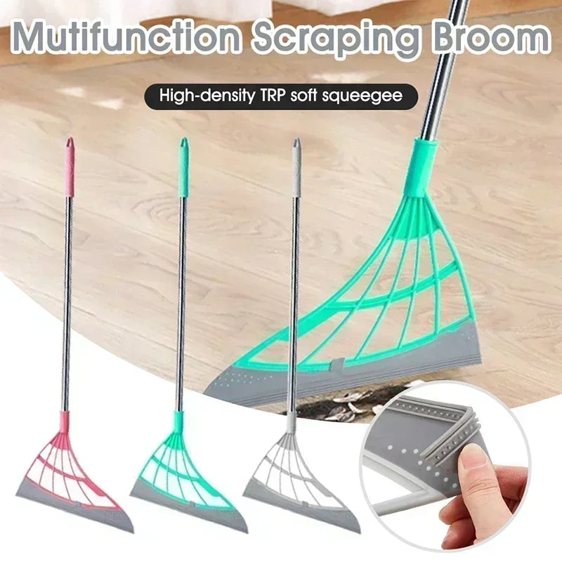 flexible silicone scraper blade pulling standing water off a wet bathroom floor