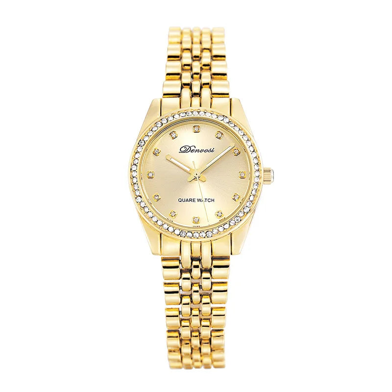 Close up of a luxury quartz watch with a geometric diamond style dial face, minimalist design, and metallic strap.