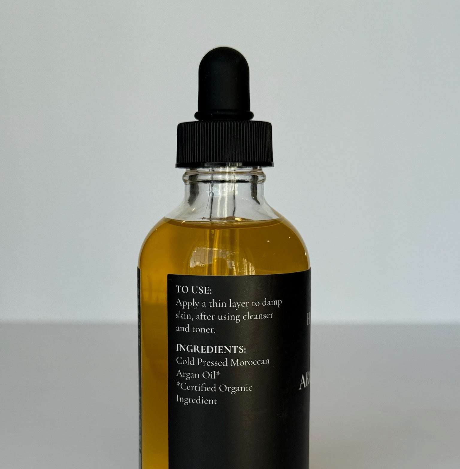 premium hydrating botanical argan face oil dropper liquid concentrate bottle
